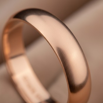 Rose gold chain glowing against linen