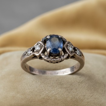 Heirloom ring before reset with worn prongs