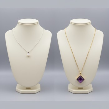 Short necklace layered with a longer one