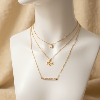 Three-necklace stack with a small pendant