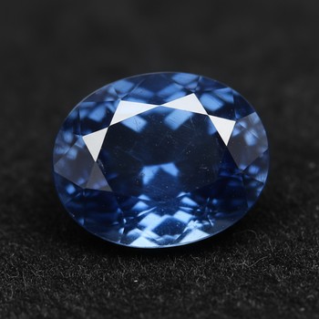 Midnight-blue sapphire surface with ocean hues