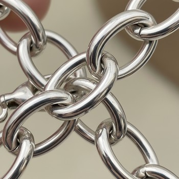 Sterling silver link reflecting window light